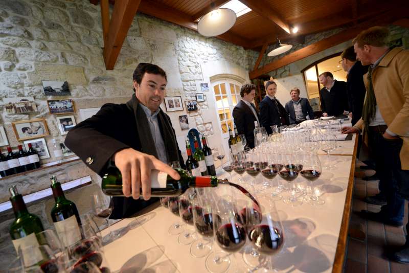 Jean-Charles Cazes prepares samples at Lynch Bages